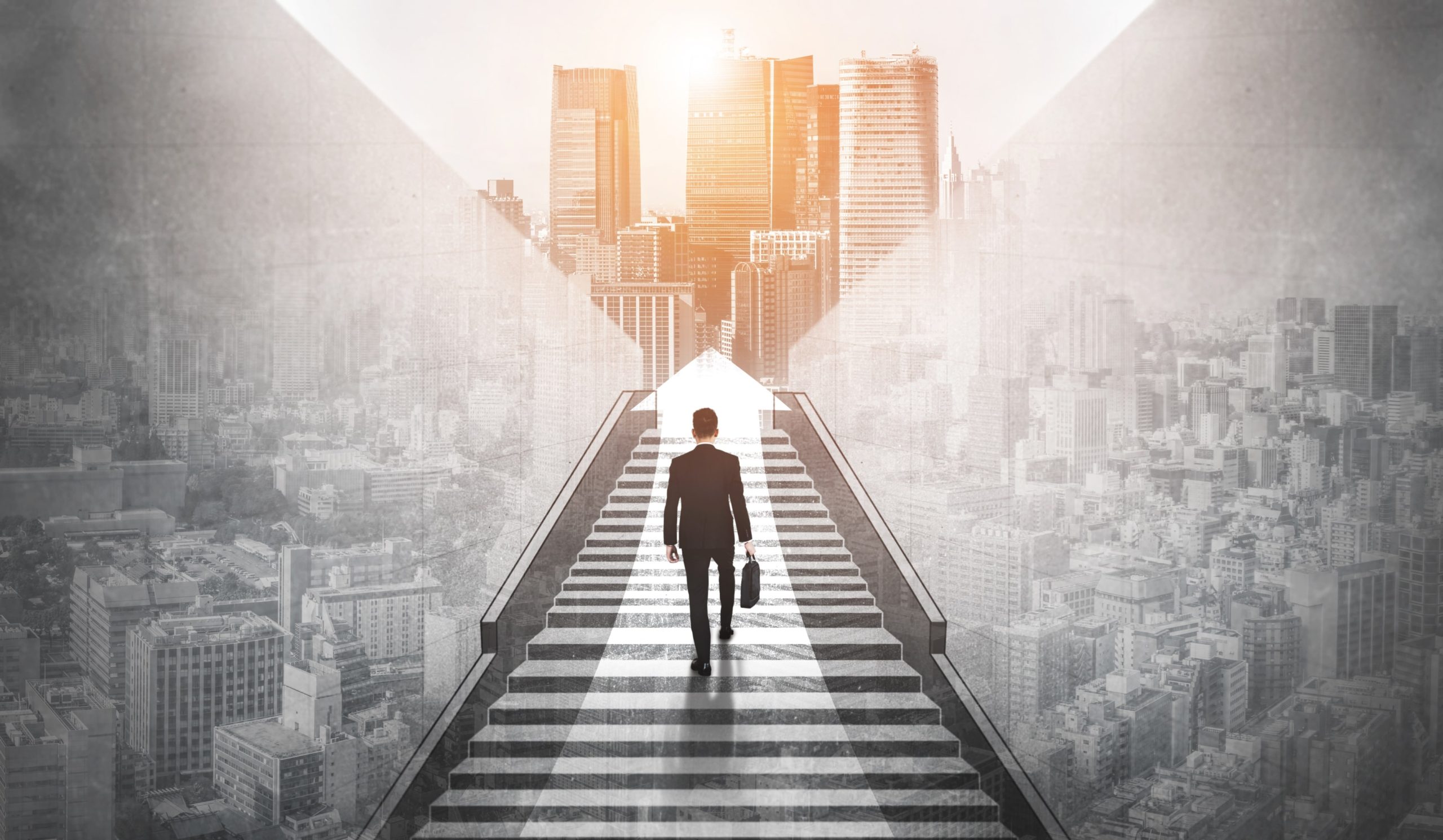 ambitious-business-man-climbing-stairs-success-min ambitious-business-man-climbing-stairs-success-min